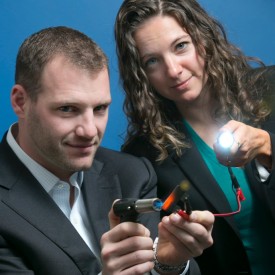 Cleantech to Market team lead Michael Lebow and College of Engineering Ph.D. candidate Sibel Leblebici demonstrate a heat-powered fuel cell that's part of a plan for reducing the environmental impact of fracking. (Photo by Jim Block)