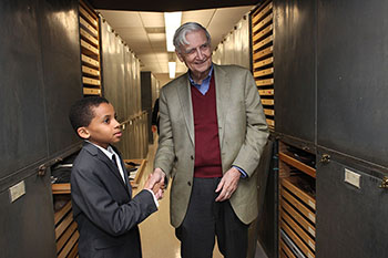 Jasper Bagley, 11, shakes hands with his idol, E. O. Wilson.