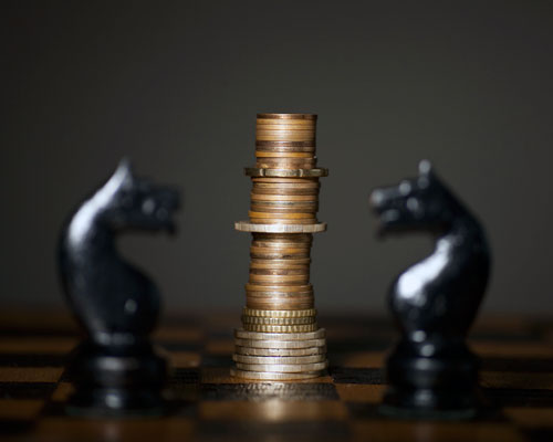 chess pieces and money