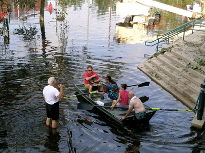 Former Tulane University President Scott Cowen gives directions to hurricane survivors outside the student rec center on the school's flooded uptown campus. (Photo courtesy of Tulane University)