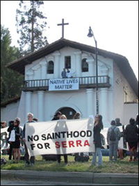 "No Sainthood for Serra" rally