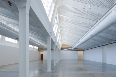 The largest gallery, with restored sawtooth roof and beam above.