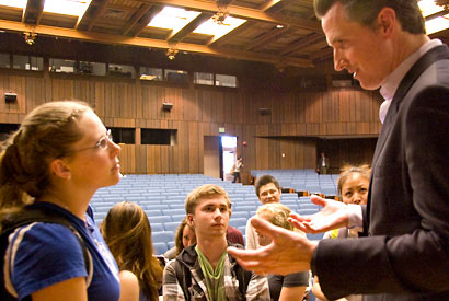 Gavin Newsom talks to a student