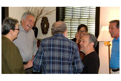 Robert Reich talking with group of people