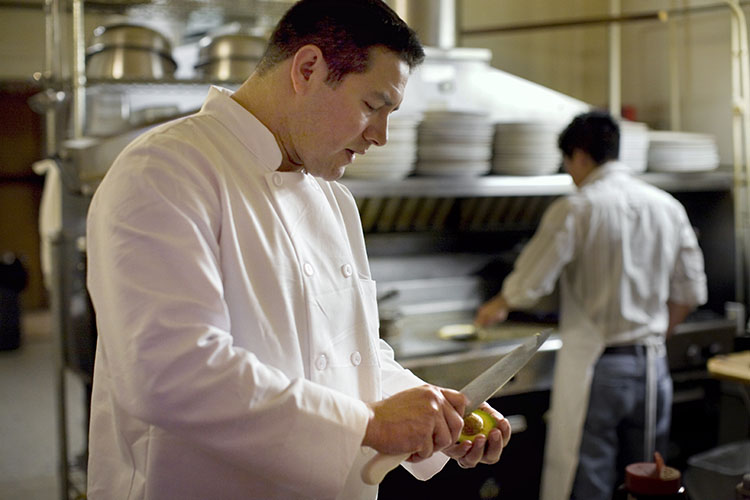 cooks working in kitchen