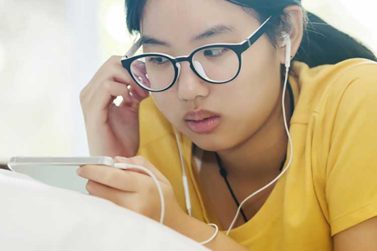 Young woman looking at her smartphone