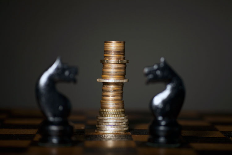chess pieces and money