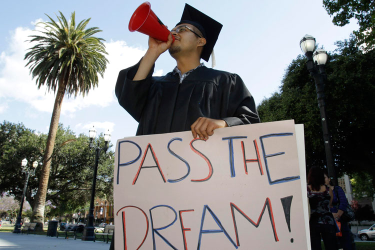 student with pass the dream sign