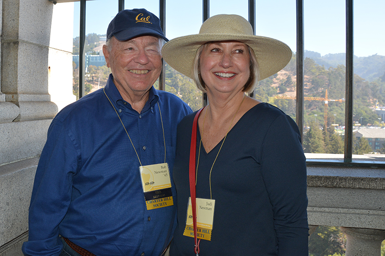 two people at the top of the campanile