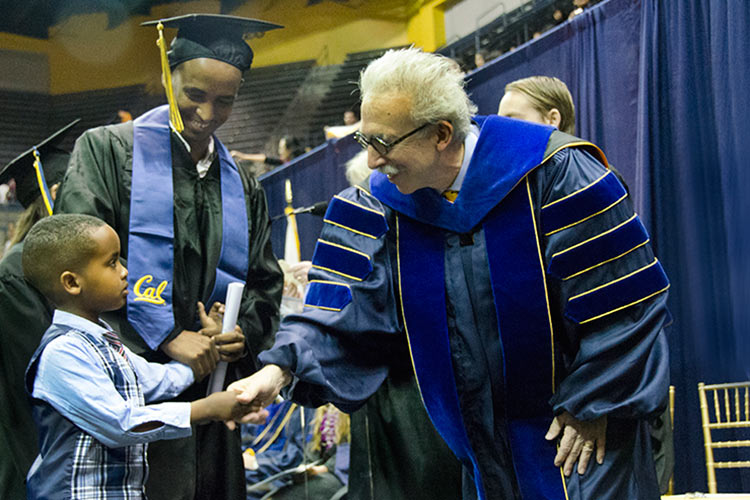 Chancellor shakes young boy's hand