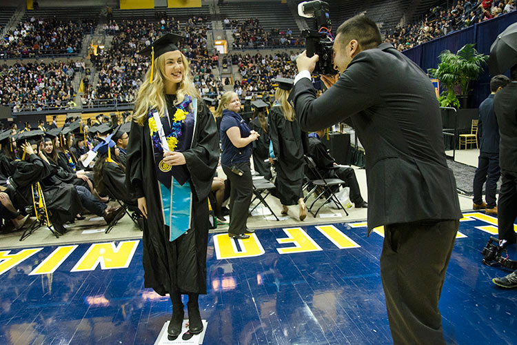 photographer taking grad's picture