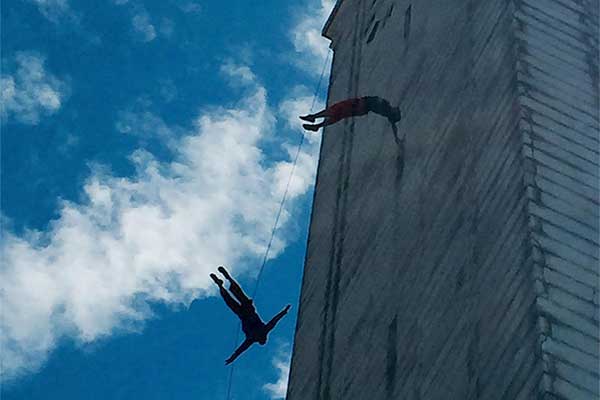 BANDALOOP vertical dance troupe dancing on Campanile