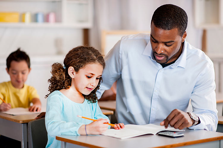 teacher helping student