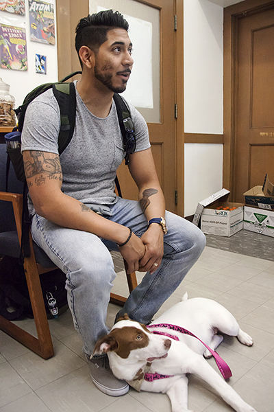 Nala, Vargas' service dog, pays a visit with him to the School of Social Welfare.