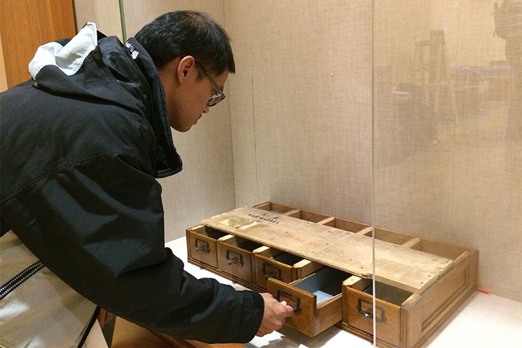 Student with card catalog that belonged to Samuel Barrett, the first graduate of UC Berkeley's anthropology department.