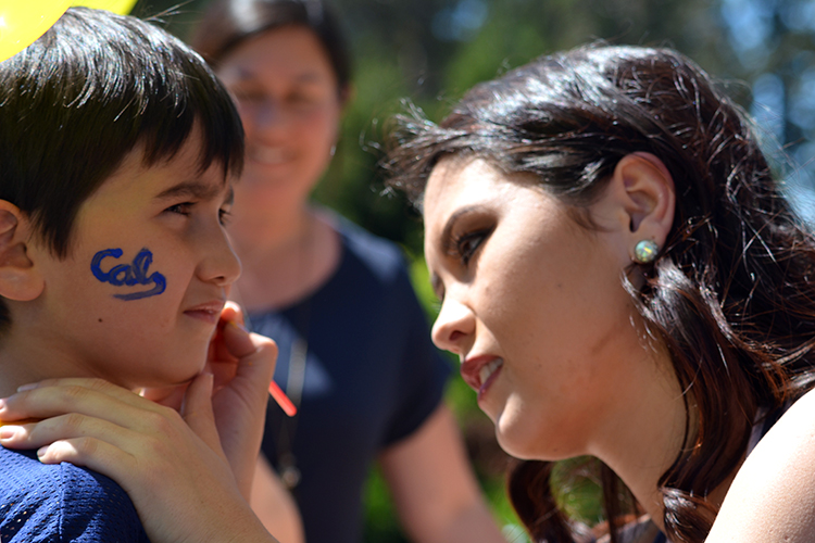 cheerleader painting kid's face