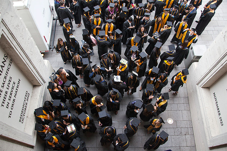 aerial shot of students gathered in robes