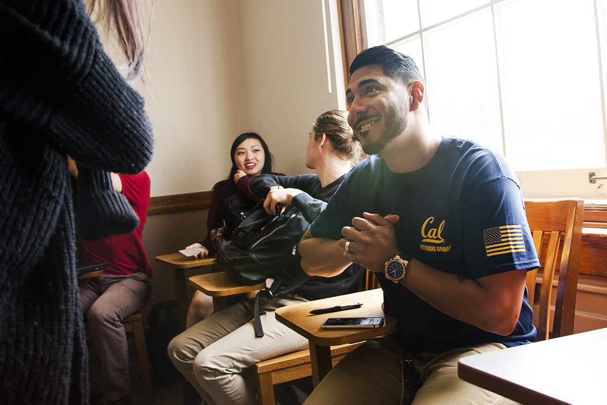 Vargas laughs with a classmate in Wheeler Hall. (UC Berkeley photo by Brittany Murphy)