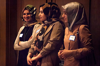 Three women listen to a speech delivered at the Ramadan Friendship Dinner. (UC Berkeley photo by Brittany Murphy)