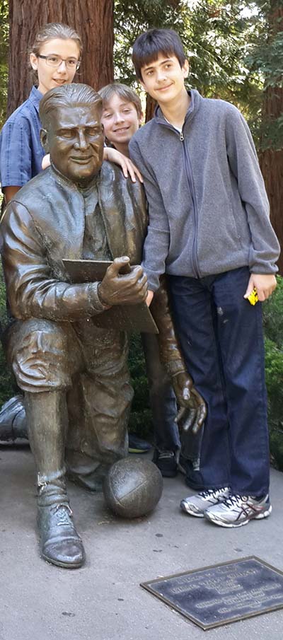 Students in a summer ATDP course pose with statue of former football coach Pappy Waldorf. (Photo by Elizabeth Scherman)