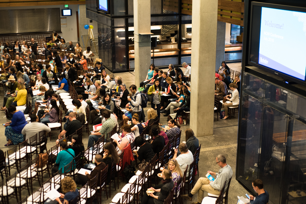 Overhead shot of many people in an auditorium during the conference