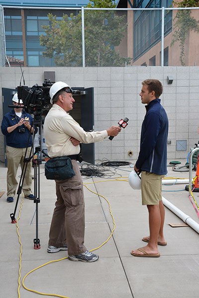 KPIX Ch. 4 interviews swimmer Hunter Cobleigh for a story on the new aquatics center. (UC Berkeley photo by Hulda Nelson)