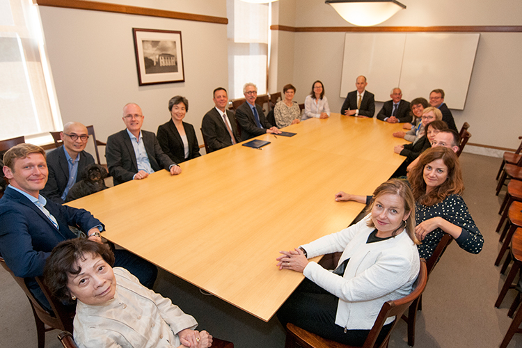 Faculty and administrators from UC Berkeley and the Free University of Berlin sit around a board room table.