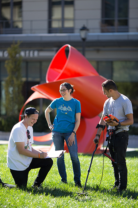 Alumnus Daniel Petrie (left) and undergraduate Aryan Sharif chat with Delgado while scanning the campus for caches of nuts buried by squirrels in their study.At times, Delgado has needed the help of 20 research assistants.At times, Delgado has needed the help of 20 research assistants. At times, Delgado has needed the help of 20 research assistants.