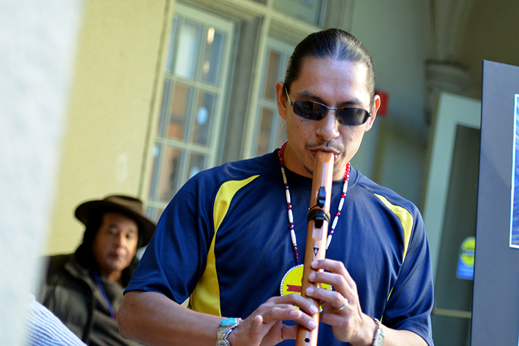 man playing flute