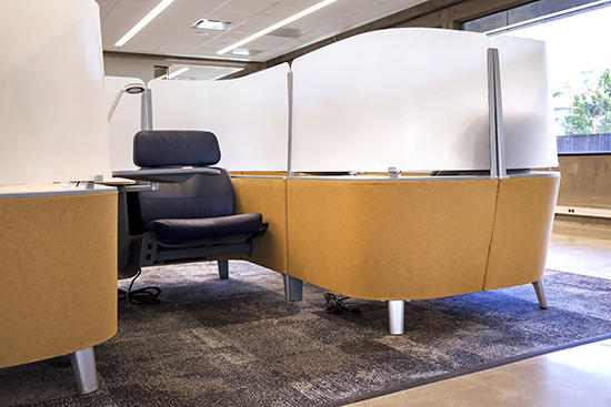 Individual, all-inclusive work areas on floor 5 offer students a more private study space and include personal lights, outlets, shelves and trays that can prop up a tablet. (UC Berkeley photo by Brittany Hosea-Small)