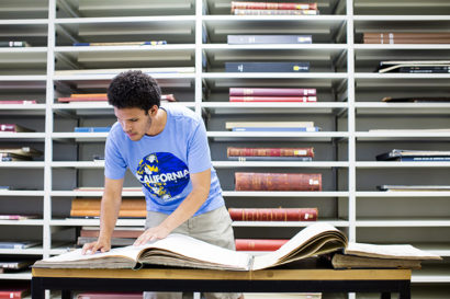 student looking at a book