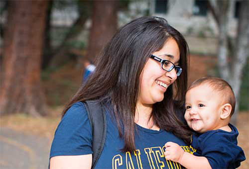 American Studies major Esperanza Campos, holding son Mauricio Ferrer, says the Cal Nourish gift cards "make a lot of difference" to student parents. (Residential and Student Service Programs photo)