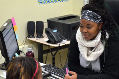 Sidney Lee working with a student