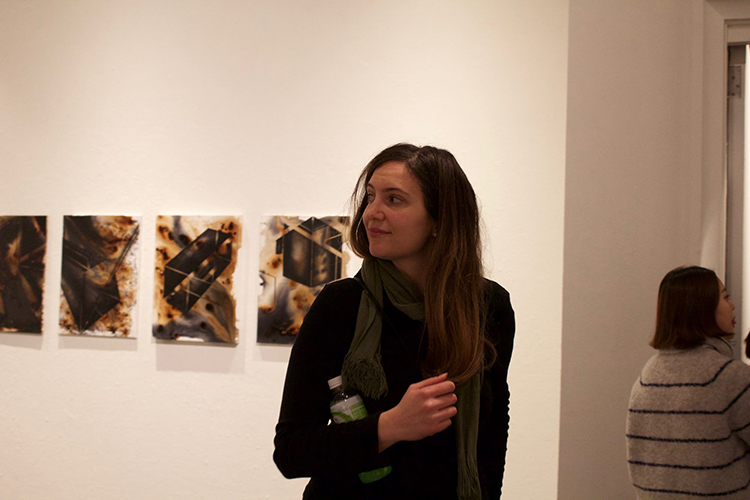 A woman looks at art in the UC Berkeley Worth Ryder art gallery during a student Fall semester capstone exhibition.