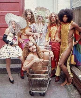 The Cockettes posing in flamboyant outfits.