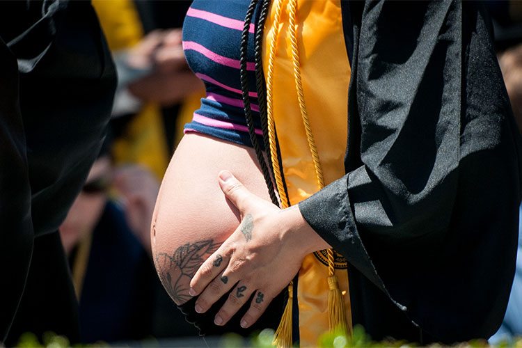 a grad with a baby bump