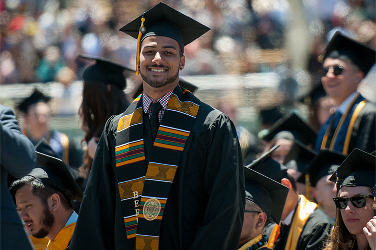 grad with colorful stole