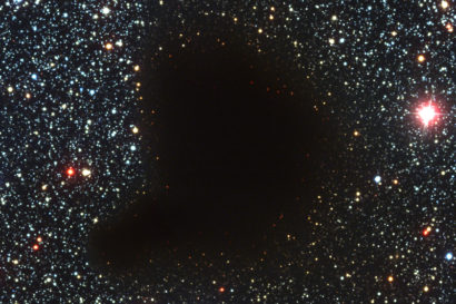 a dark molecular cloud in which stars are forming