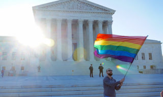 man with rainbow flag