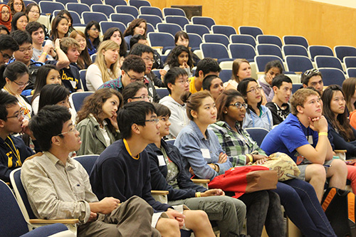 Students seated in an auditorium attentively listening to a presentation at UC Berkeley.