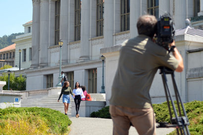 Roaya and Nissma being filmed on campus