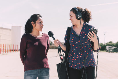 reporter talking to woman