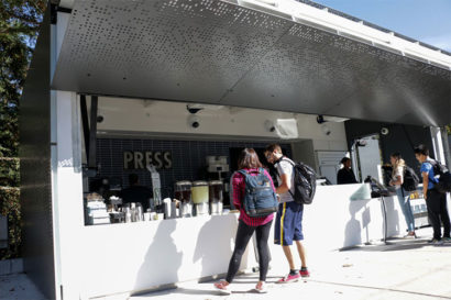 Students stand in line and order coffee from a cafe