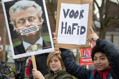 protestors holding anti-Wilders signs