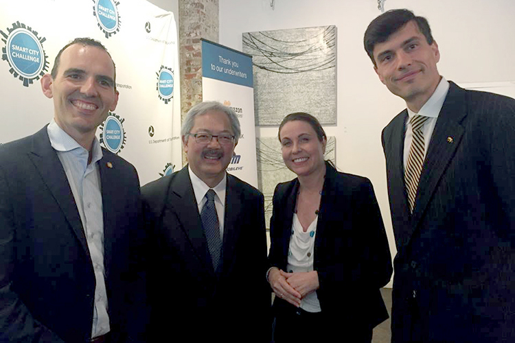 Mayor Ed Lee stands with Susan Shaheen and Alex Bayen of the UC Berkeley Institute for Transportation Studies.