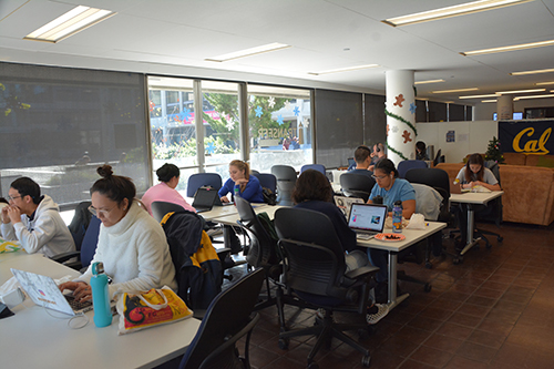 Students working at desks in the Transfer Student Center at UC Berkeley.