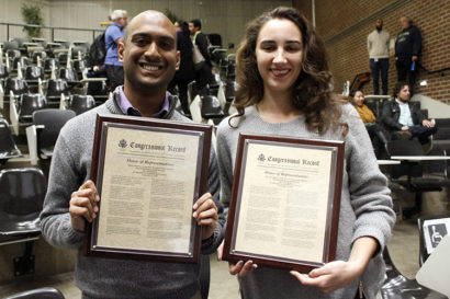 UC Berkeley graduate students Vetri Velan and Kathy Shield stand with their award from Lee.