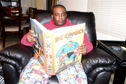 alfred day reading a big comic book