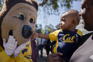 Domonic Hampton holds his son Dylan Hampton, 6 mon., as Dylan meets Oski for the first time during Cal Day at UC Berkeley on Saturday, April 21, 2018.