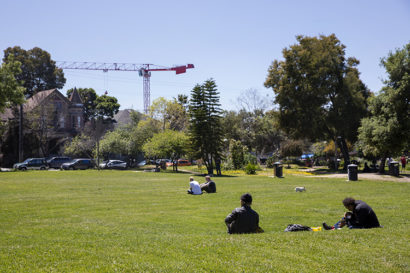 People sit and relax in the sun at People's Park in Berkeley, Calif. on Friday, April 20, 2018. (UC Berkeley photo by Brittany Hosea-Small)